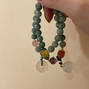 French vintage beaded bracelet with natural green stones and colorful accents