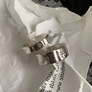 Irregular starburst textured open ring with silver finish and sparkling zircon stone
