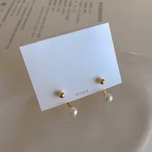 Detail of freshwater pearl earring with 925 silver needle and gold metal post studs