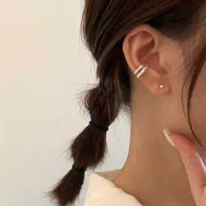 Irregular double-layer silver metal ear cuff and minimalist stud earring set on model