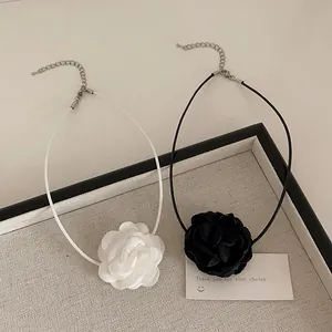 Elegant set of two camellia flower chokers in black and white with thin rope chains
