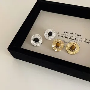 French vintage irregular metal stud earrings set with natural stone in gold and silver