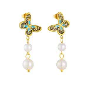 Elegant gold butterfly earrings with blue enamel wings and glossy white round pearls