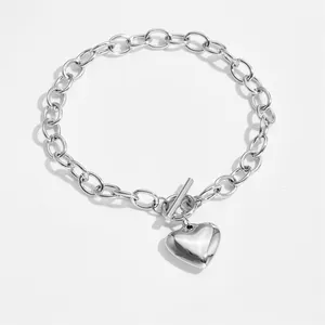 Detailed macro view of silver heart pendant with OT toggle clasp and oval link chain