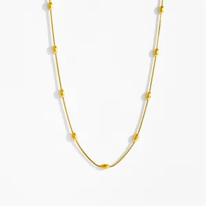 Minimalist double-layered gold snake chain necklace with smooth oval bead accents