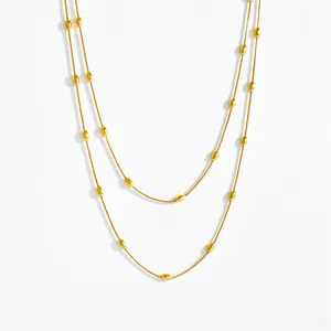 Double-layered golden stainless steel snake chain necklace with smooth oval beads for women