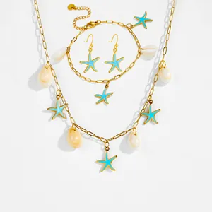 Set di gioielli dorati con conchiglia e stella marina blu collana e bracciale