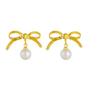 Elegant 18k gold butterfly bow earrings with large round pearls in French vintage style