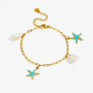 Set gioielli da spiaggia dorati con ciondoli a stella marina blu e conchiglie bianche