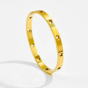 Elegant gold octagram bangle with star-shaped cutouts and a polished mirror finish