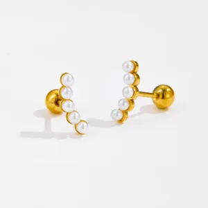 Detailed macro view of gold curved pearl stud earrings with secure ball-back screw closures