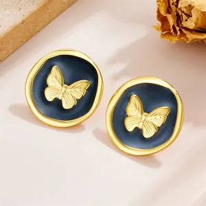 French vintage butterfly stud earrings in gold and navy blue enamel with artistic frame
