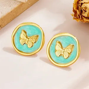 Vintage French butterfly stud earrings with gold metal frame and mint green marble texture