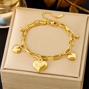 Elegant double-layered gold stainless steel bracelet with three heart pendants and ball chain