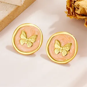 French vintage butterfly stud earrings in gold plated stainless steel with marble texture