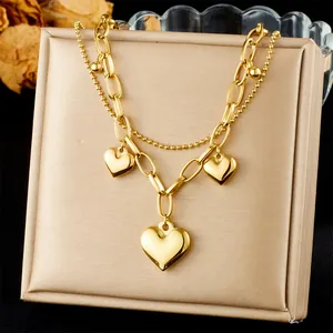 Double-layered golden stainless steel heart pendant bracelet with bead and oval chains