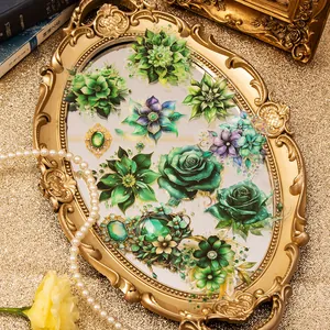 Vintage floral and gemstone sticker pack with rose and daisy designs on a golden tray