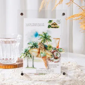 Vertical acrylic photo frame with tropical card on white lace tablecloth and warm background