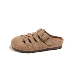 Girl's brown hollow suede closed-toe mules with adjustable buckle and non-slip sole
