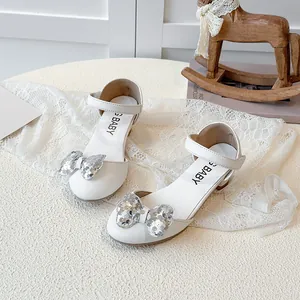 Girls' white Mary Jane princess shoes featuring a silver sequined bow and low heels