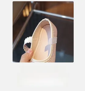 Detail of pink glitter girls' princess shoes with wave lace trim and breathable lining