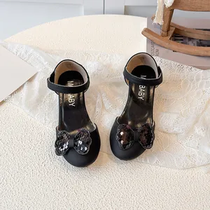 Girl's black Mary Jane heels with sequin bow and ankle strap for formal occasions