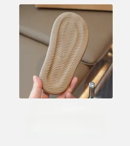 Close-up of girls' sandals featuring non-slip wave texture rubber sole with size 28 marking