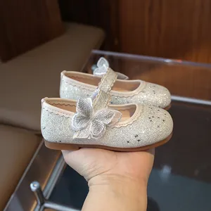 Silver sequin Mary Jane shoes for girls with embroidered bow and star pattern detail