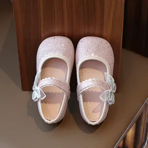 Sparkly pink sequin Mary Jane shoes for girls with cute tulle bow and wavy strap
