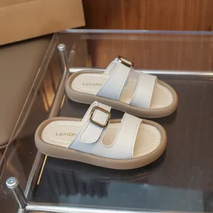 Fashionable girls beige platform slides with double straps and golden metal buckles