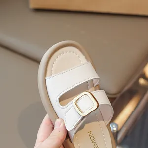 Chic beige girls' sandals with soft textured leather and gold metal buckles