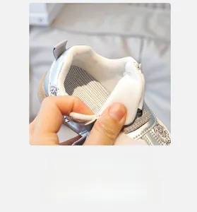 Detail of breathable mesh lining and soft anti-slip insole on metallic silver kids sneaker