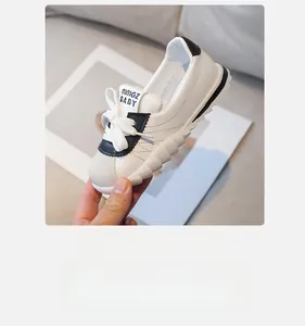 Detailed macro shot of white leather kids sneakers with non-slip sawtooth rubber sole
