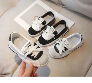 Close-up of children's soft-sole sneakers with leather upper and reinforced toe cap
