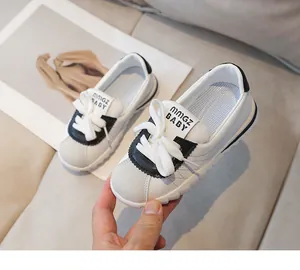 Detail showing the soft rubber sole and leather texture of these kids' casual sneakers