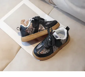 Detail view of children's floral sport sneakers with Velcro strap and rubber sole