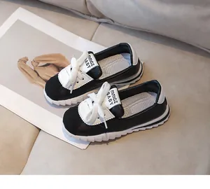 Detail of children's sneakers showing non-slip sawtooth sole and MMGZ BABY tongue label