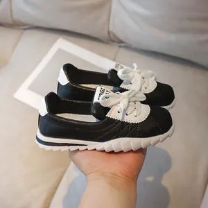 Kids black and white leather sneakers with thick non-slip rubber soles for boys and girls