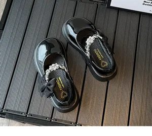 Détails de babies noires vernies pour filles avec fleurs en strass et nœud en tissu