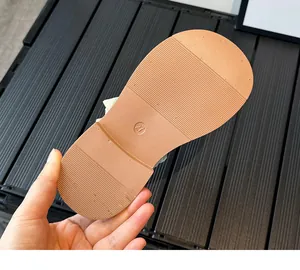 Detailed view of non-slip rubber sole with size 21 marking on kids Mary Jane shoes