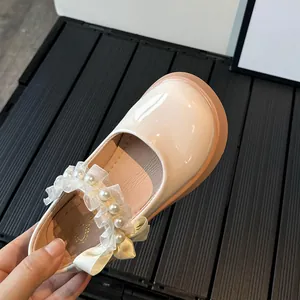 Cream Mary Jane girls princess shoes with lace ruffle, pearls and satin bow detail