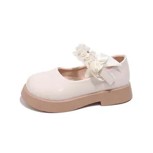 Elegant cream Mary Jane shoes for girls with lace bow and pearl details on thick soles