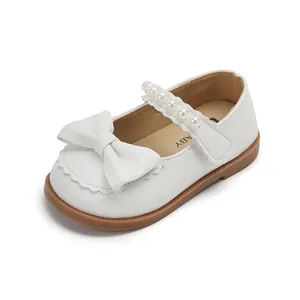 Classic white girls' Mary Jane shoes with elegant bow and pearls for formal events