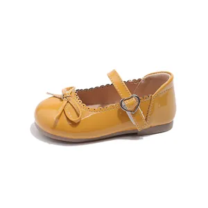 Zapatos Mary Jane clásicos de charol amarillo para niña con lazo y ondas