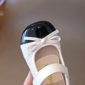 Girls black and white tweed Mary Jane shoes with patent leather toe and bow details