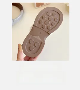 Detailed view of non-slip rubber sole with size 28 marking and textured grip pattern