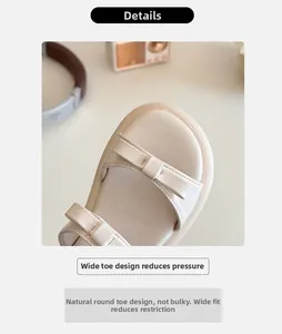 Detail of girls cream bow sandals featuring a round toe and premium matte leather texture