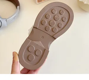 Detail of size 23 non-slip rubber sole with round patterns for girls princess shoes