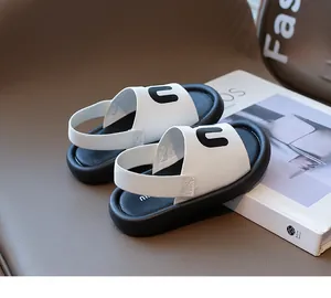 Detail of children's sandals featuring bold letter U and comfortable elastic backstrap