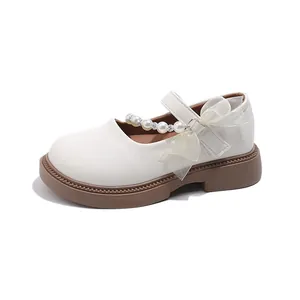 Girls cream Mary Jane shoes with pearl rhinestone bow and durable soft rubber sole